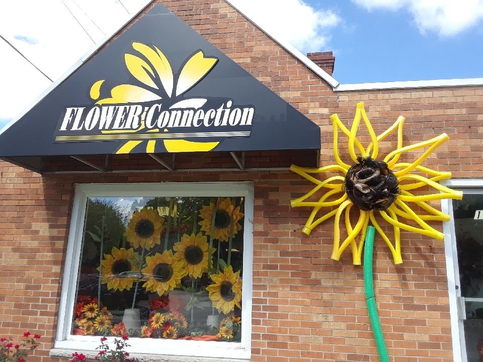 Storefront with a giant sunflower